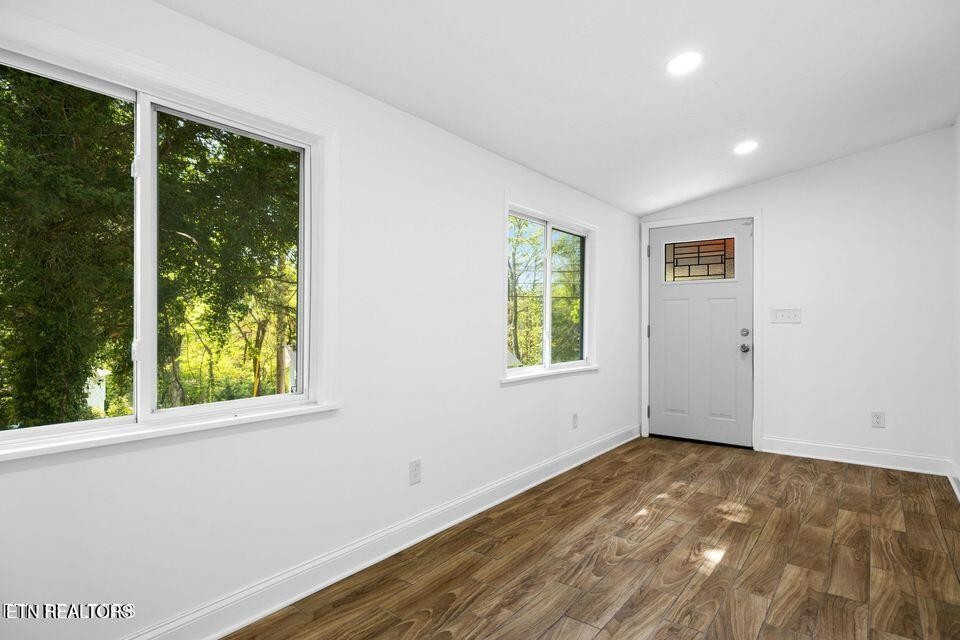 516 Delaware Avenue Oak Ridge, TN 37830 - Photo 22 of 43 a view of a big room with wooden floor and windows