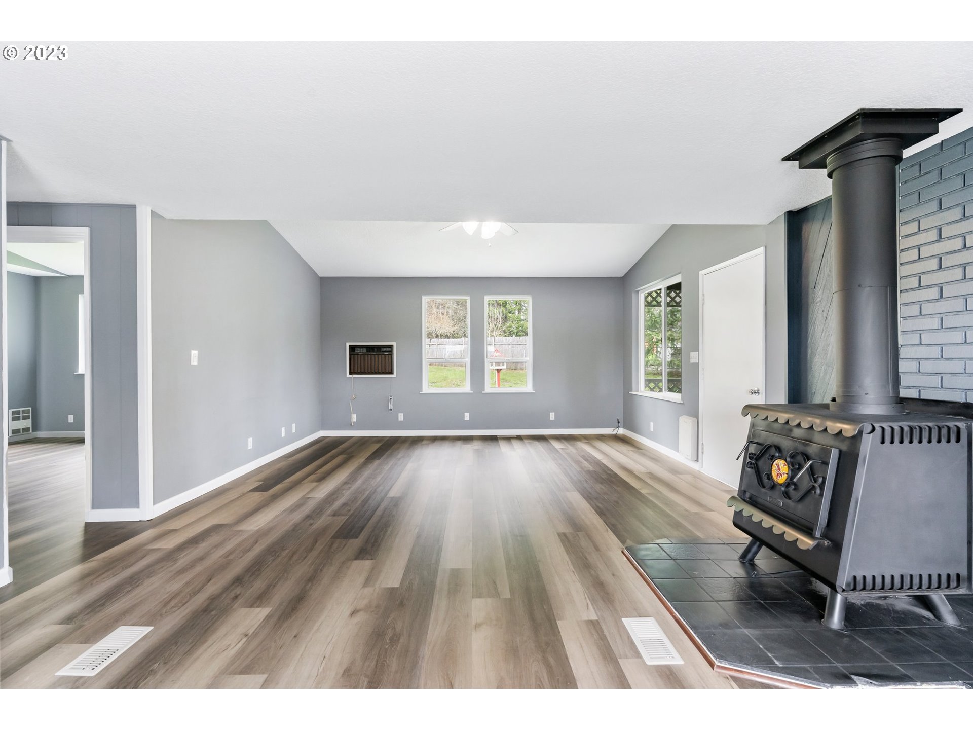 9183 Southwest Line Drive Cornelius, OR 97113 - Photo 14 of 38 wooden floor in an empty room with a window