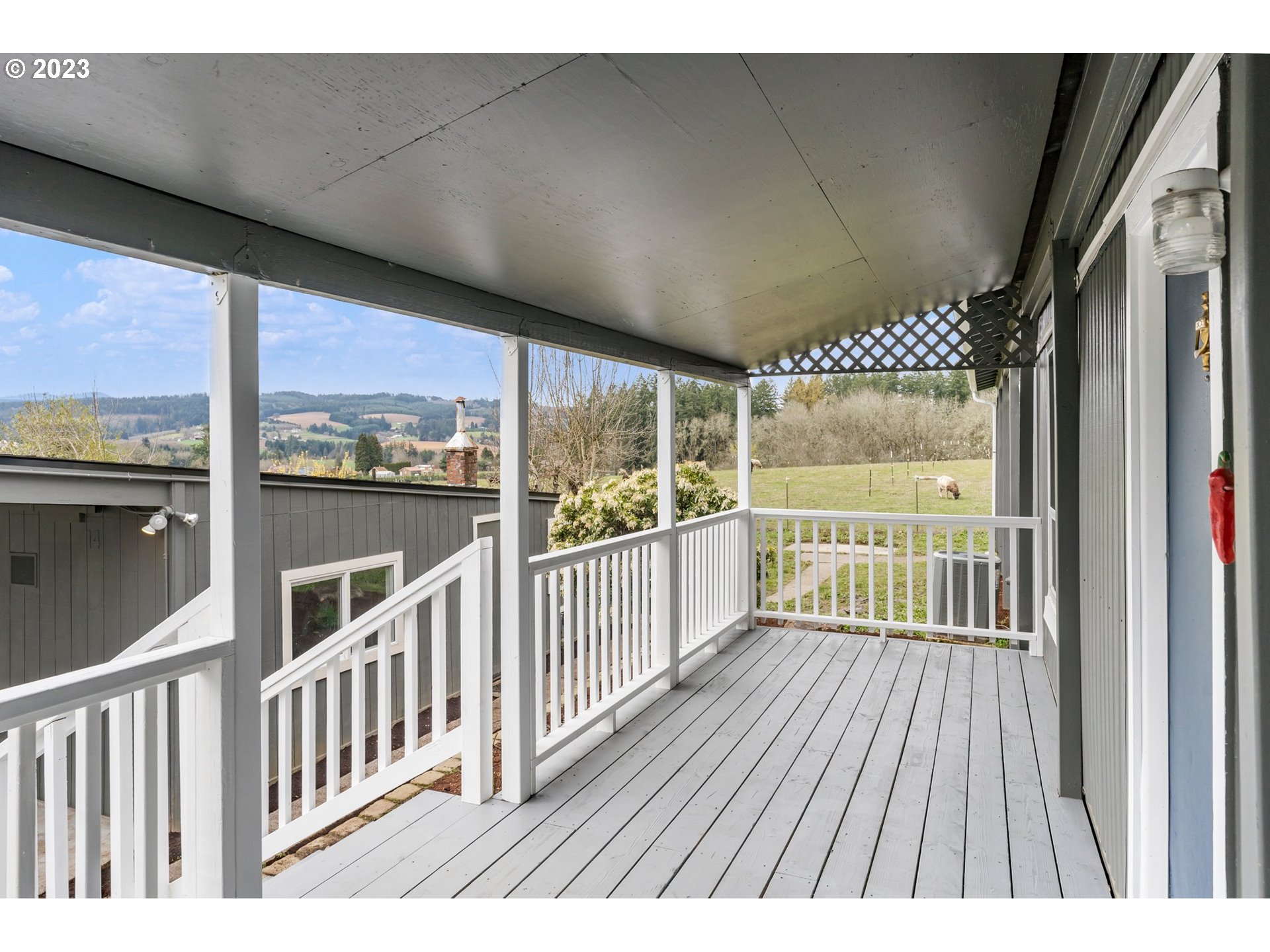 9183 Southwest Line Drive Cornelius, OR 97113 - Photo 3 of 38 a view of a porch with wooden floor