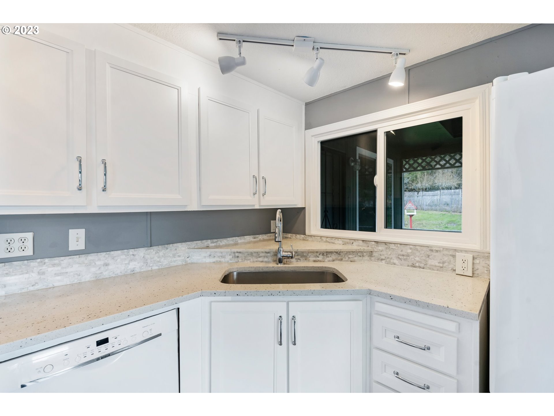 9183 Southwest Line Drive Cornelius, OR 97113 - Photo 9 of 38 a sink with white cabinets