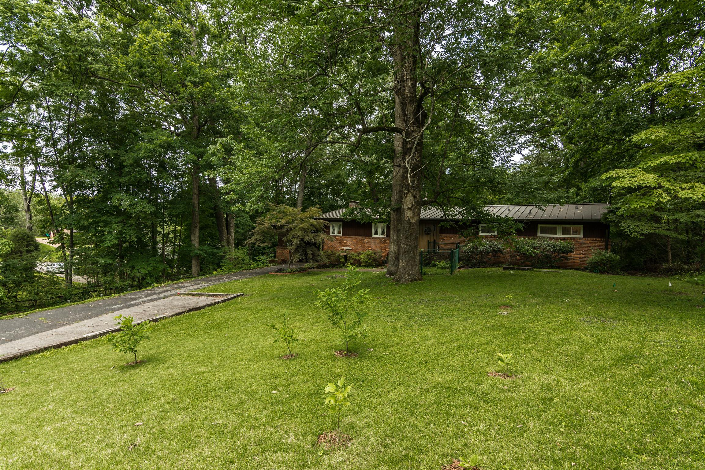 413 Golfview Lane Springfield, TN 37172 - Photo 3 of 29 Extra driveway pavement to handle the family vehicles...