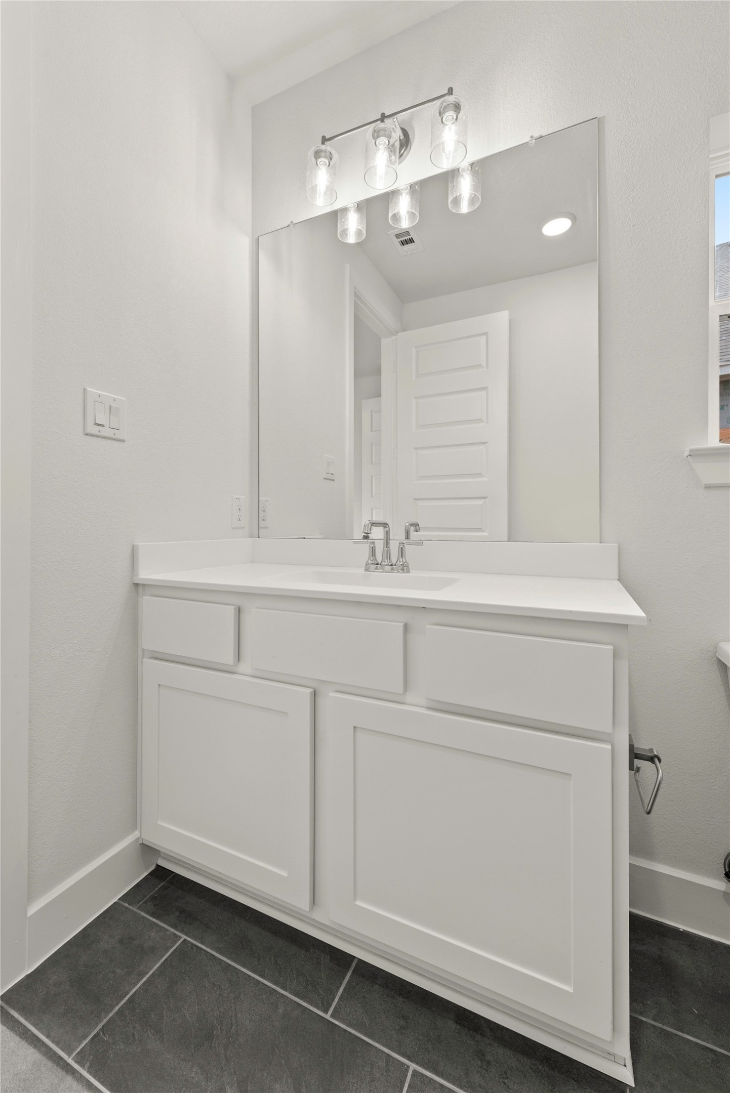18917 Moonriver Street Conroe, TX 77302 - Photo 15 of 28 a bathroom with a sink and a mirror