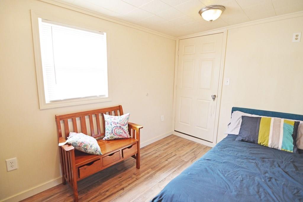 111 Groton Street Springfield, MA 01129 - Photo 14 of 26 a bedroom with a bed and a window