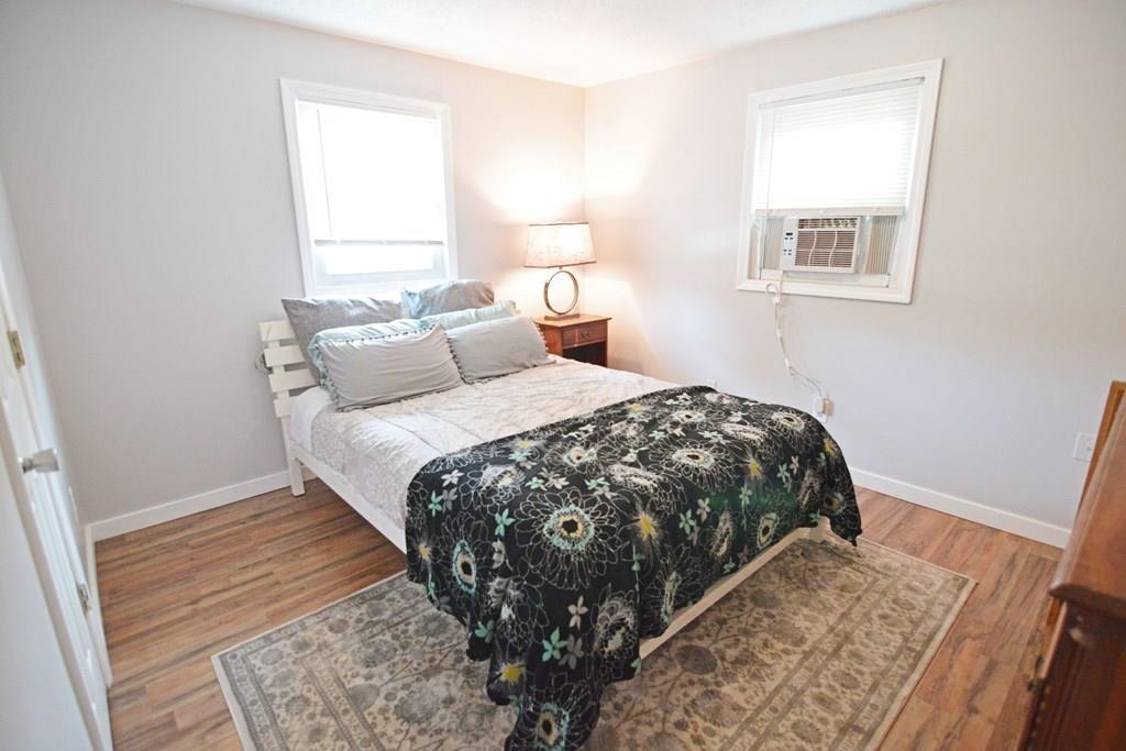 111 Groton Street Springfield, MA 01129 - Photo 15 of 26 a bedroom with a bed and a window
