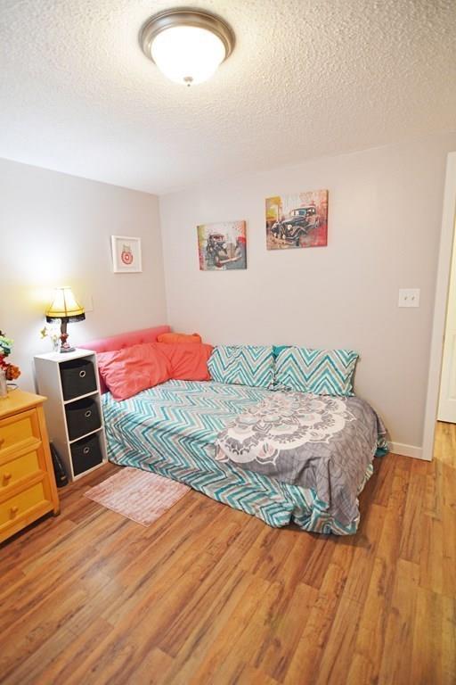 111 Groton Street Springfield, MA 01129 - Photo 17 of 26 a bedroom with a bed and dresser