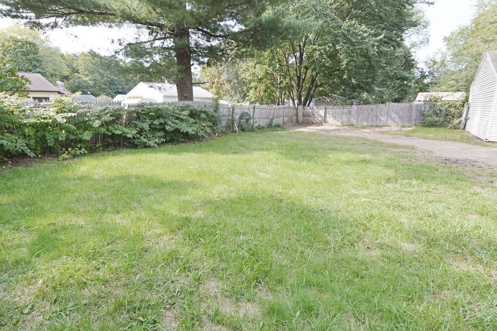 111 Groton Street Springfield, MA 01129 - Photo 23 of 26 a view of a yard with a tree