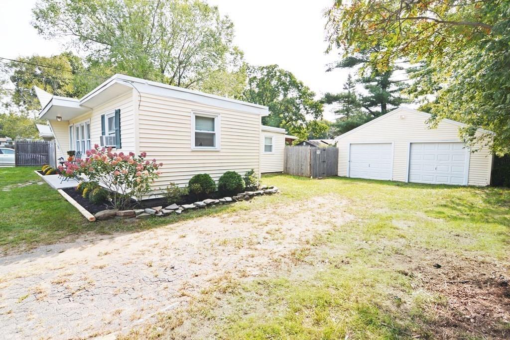 111 Groton Street Springfield, MA 01129 - Photo 25 of 26 a view of a house with yard and a garden