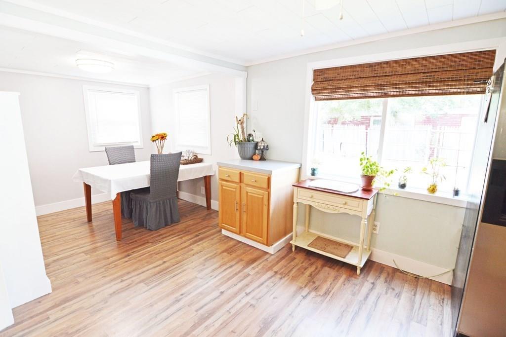 111 Groton Street Springfield, MA 01129 - Photo 8 of 26 a kitchen with a wooden floor and white appliances