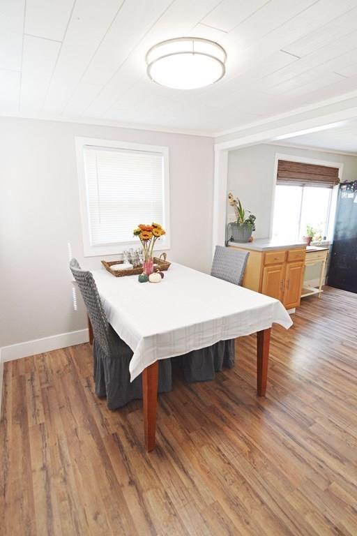 111 Groton Street Springfield, MA 01129 - Photo 10 of 26 a view of a dining room with furniture and wooden floor