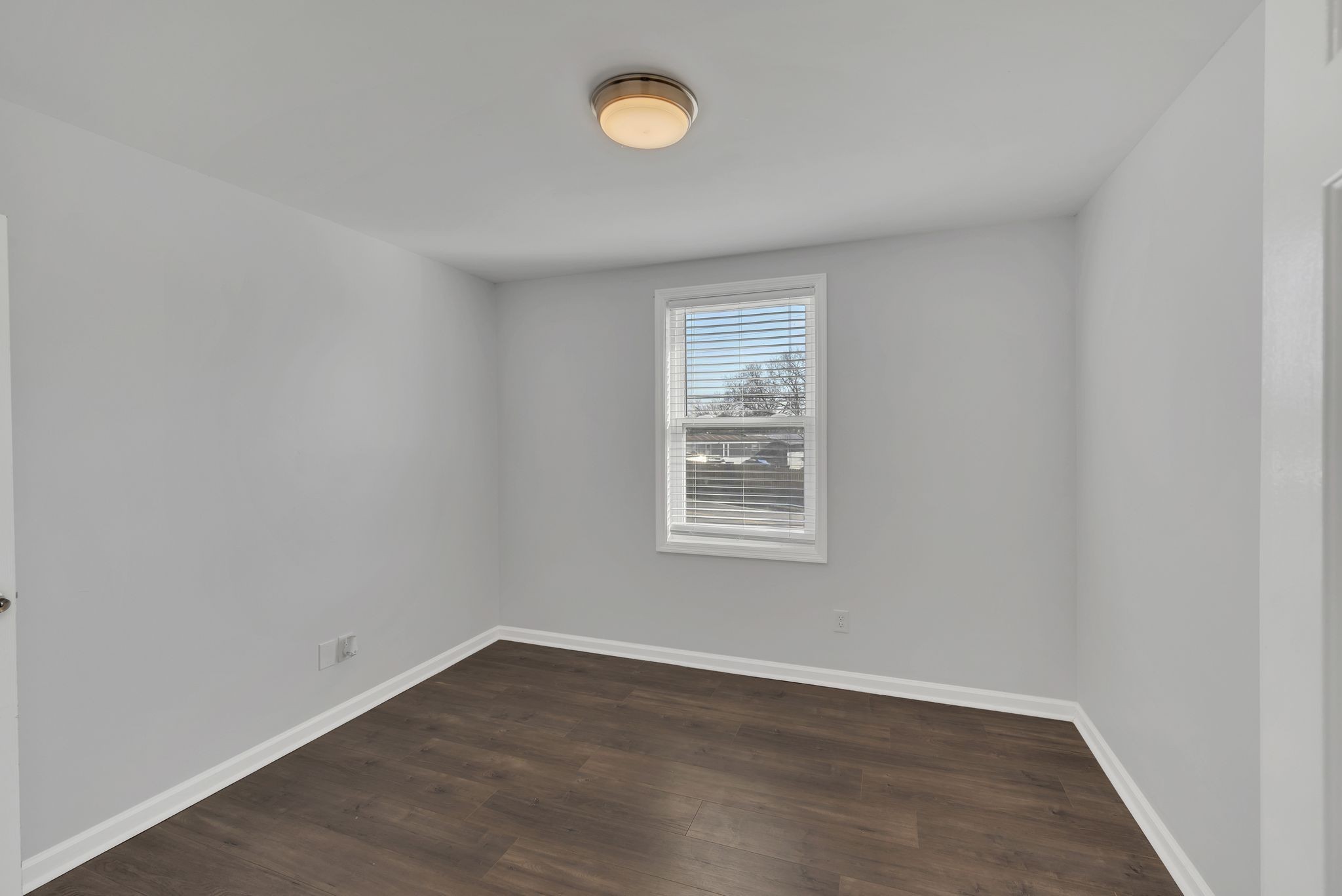 1016 Cheyenne Boulevard Madison, TN 37115 - Photo 16 of 25 an empty room with wooden floor and windows