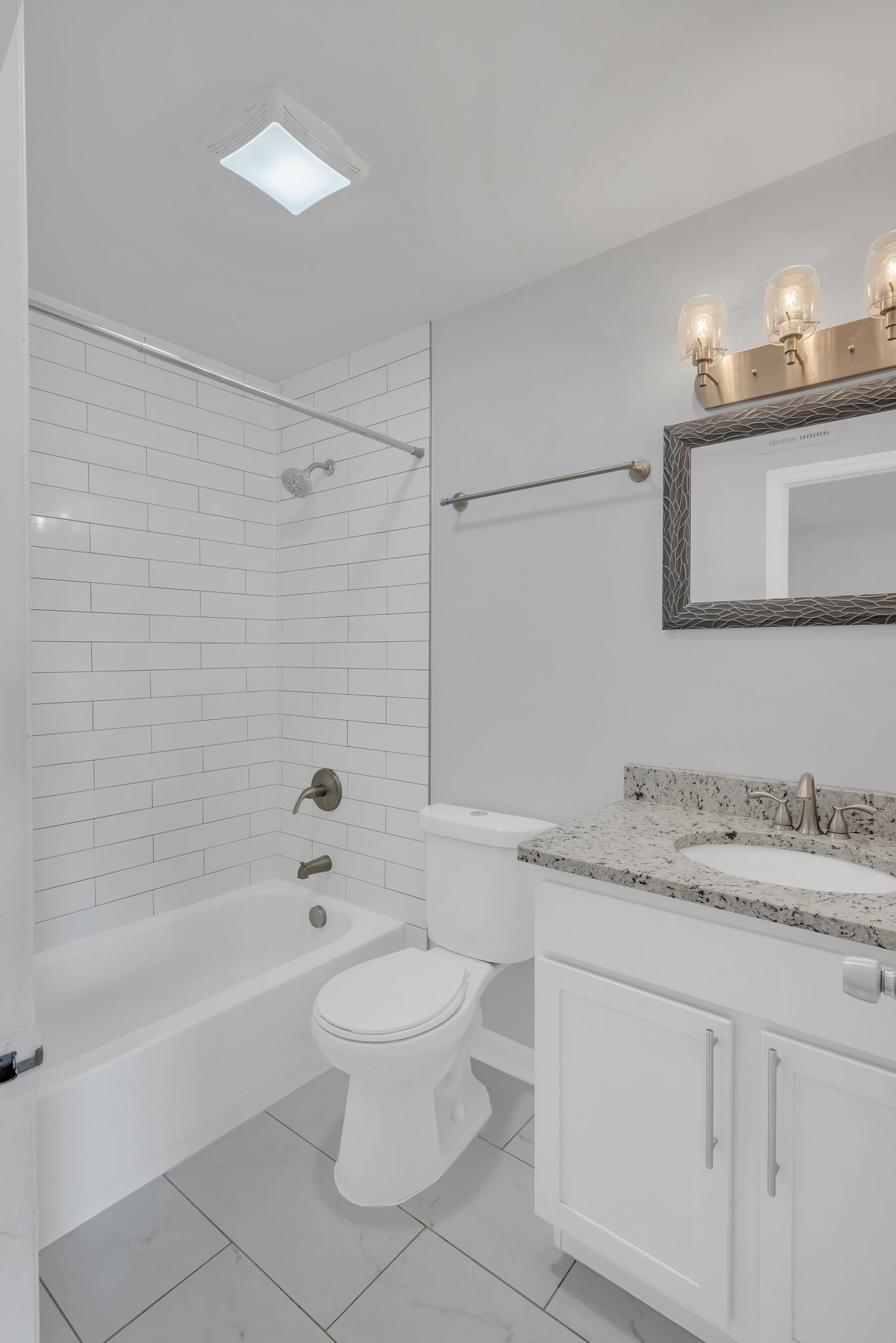 1016 Cheyenne Boulevard Madison, TN 37115 - Photo 18 of 25 a bathroom with a granite countertop sink a toilet and shower