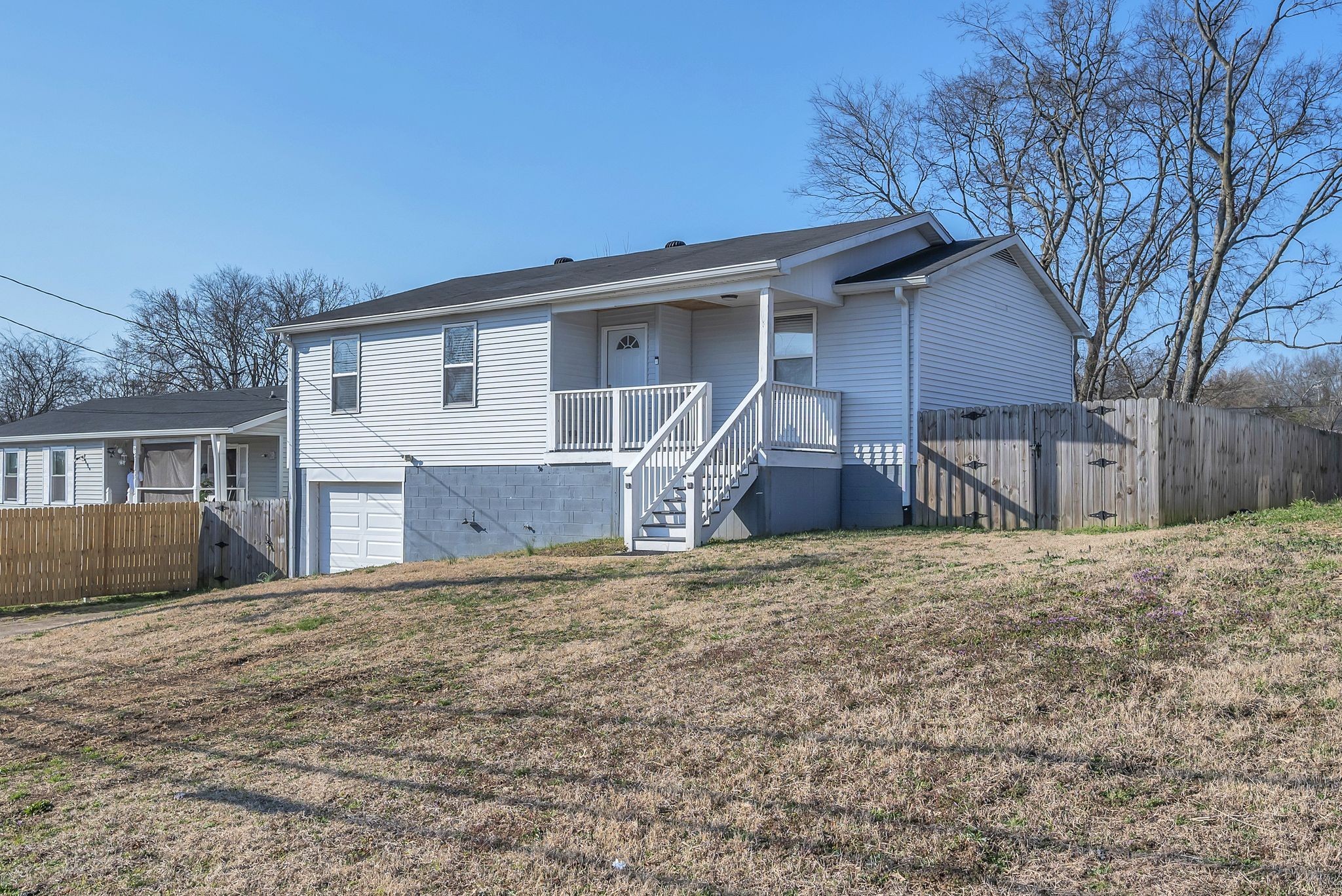1016 Cheyenne Boulevard Madison, TN 37115 - Photo 2 of 25 a front view of house with yard and trees