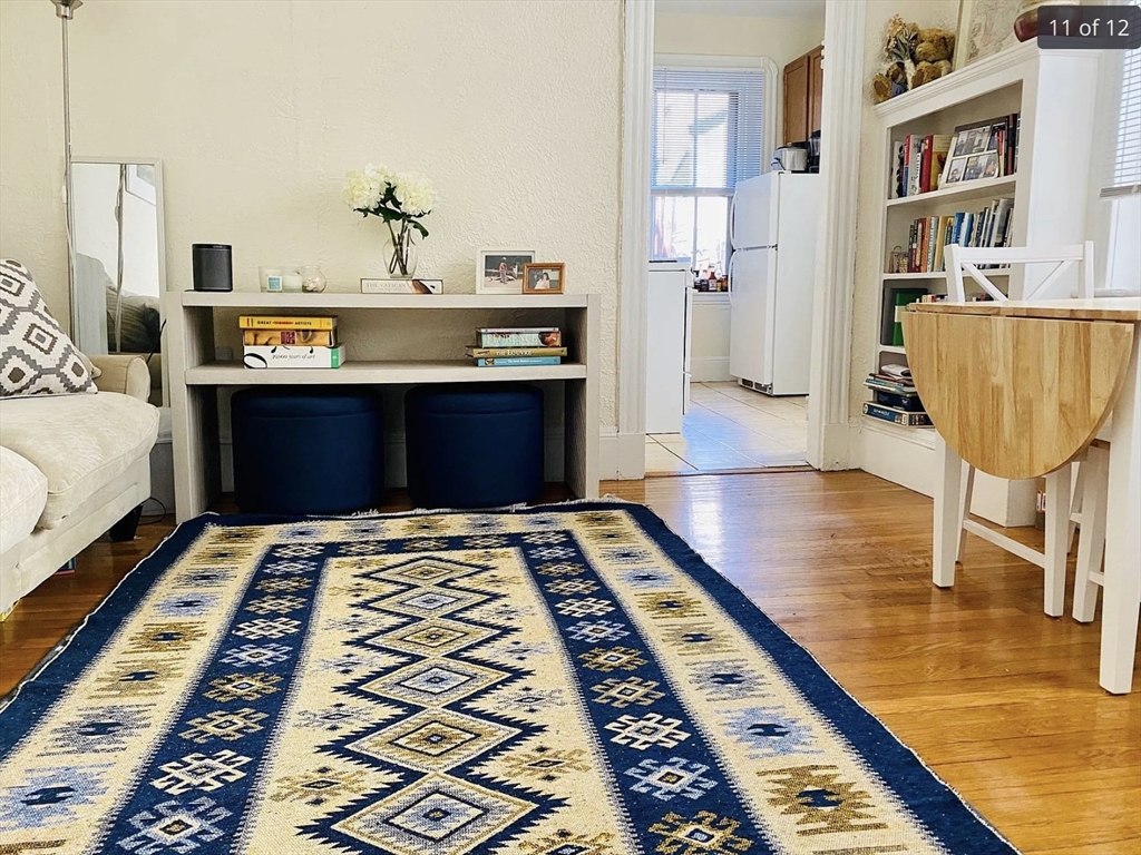 23 Temple Street, Unit 6 Boston, MA 02114 - Photo 2 of 10 a bedroom with wooden floor rug and a rug