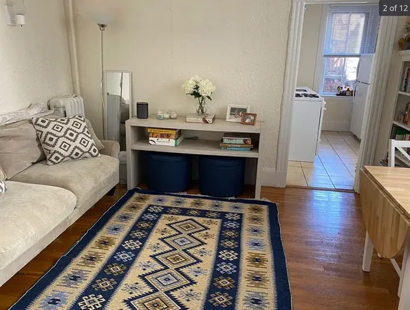 a living room with furniture and a rug