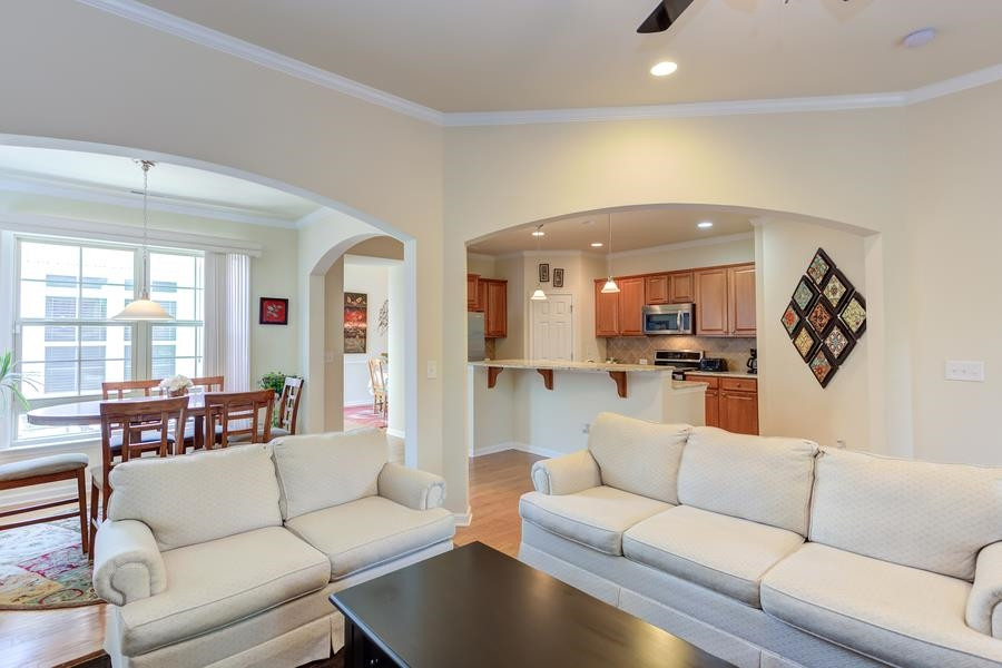 Spacious and bright living room is open to breakfast area and kitchen. Living Room