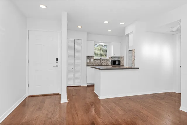 a view of kitchen with wooden floor