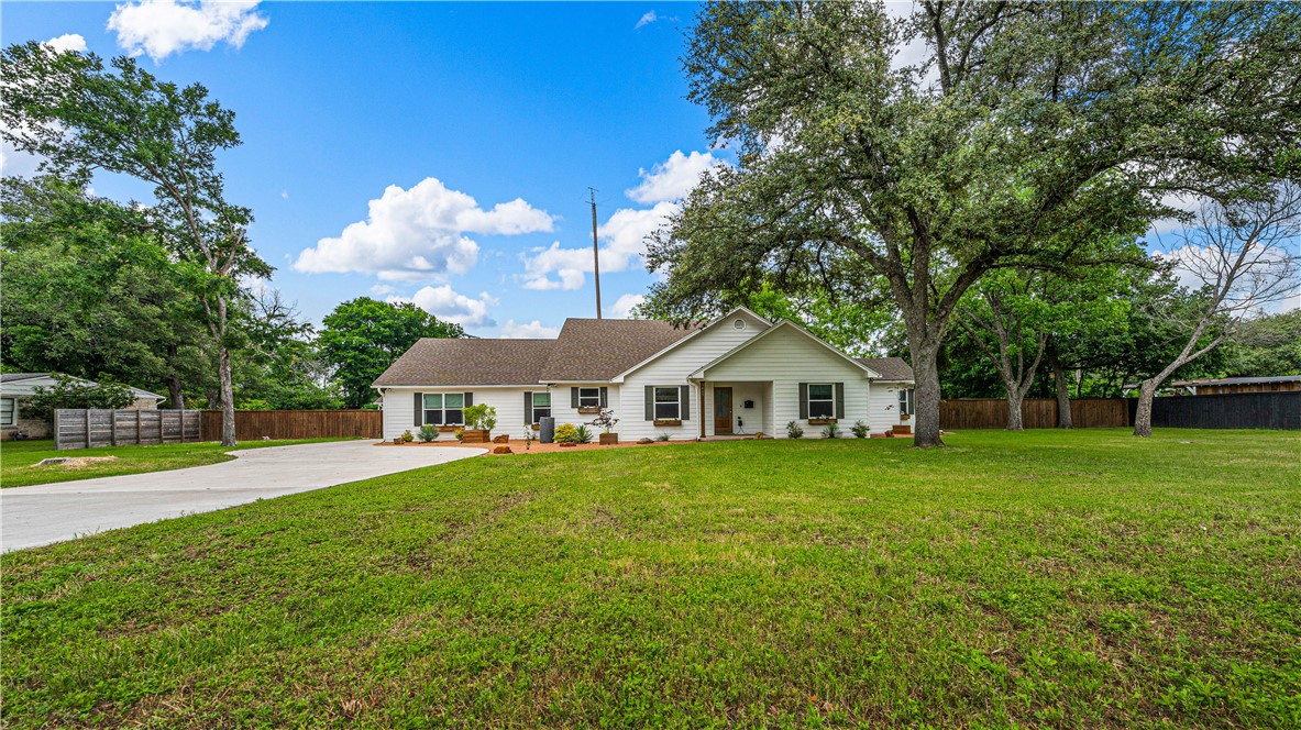 3405 MacArthur Drive Waco, TX 76708 - Photo 18 of 83 a front view of a house with a yard and trees