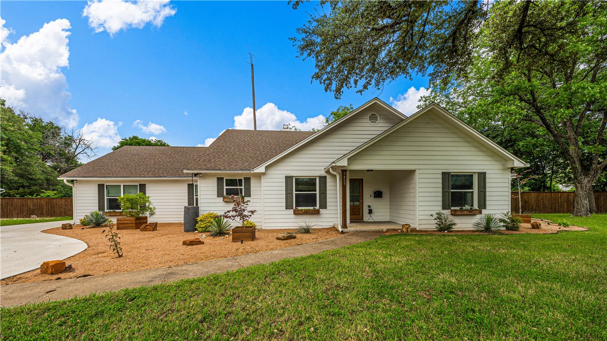 3405 MacArthur Drive Waco, TX 76708 - Photo 21 of 83 a front view of house with yard and outdoor seating