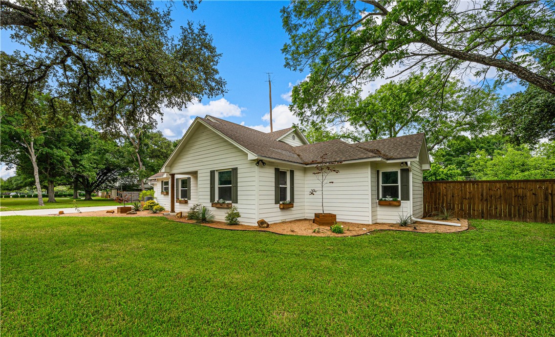 3405 MacArthur Drive Waco, TX 76708 - Photo 22 of 83 a front view of house with a garden and trees