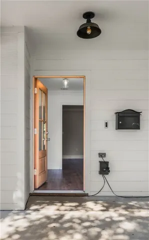 a spacious bathroom with a granite countertop sink a mirror and a