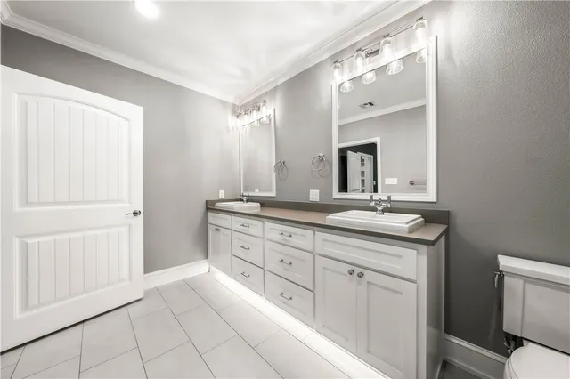 a front view of a house with yard and green space