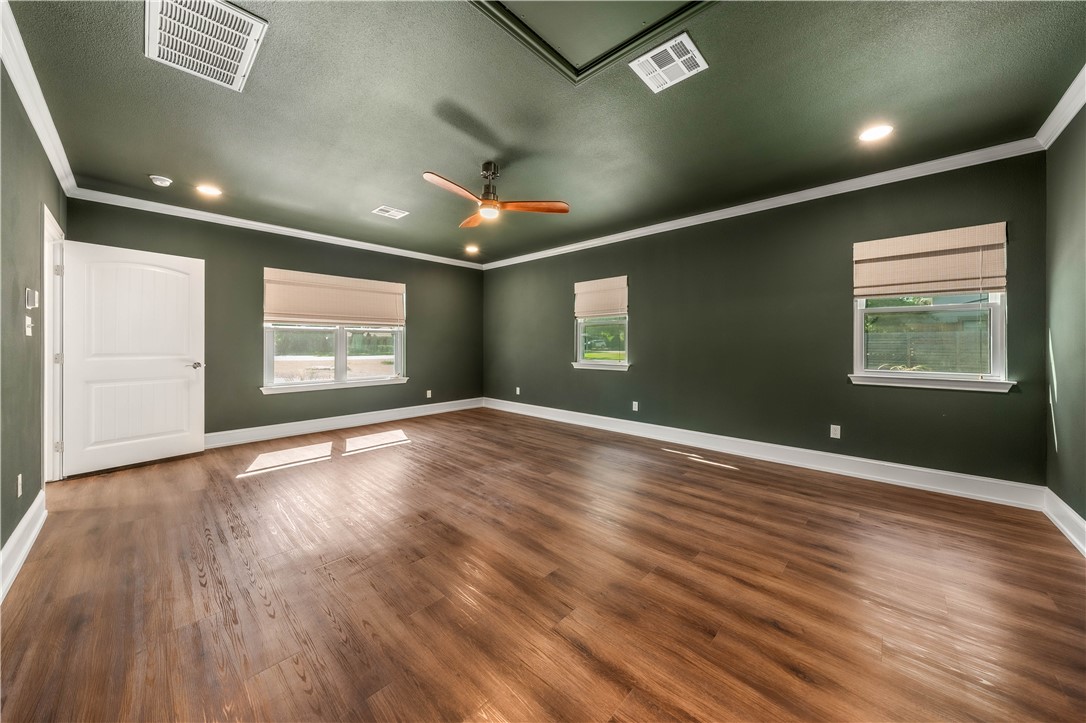 3405 MacArthur Drive Waco, TX 76708 - Photo 42 of 83 an empty room with wooden floor and windows
