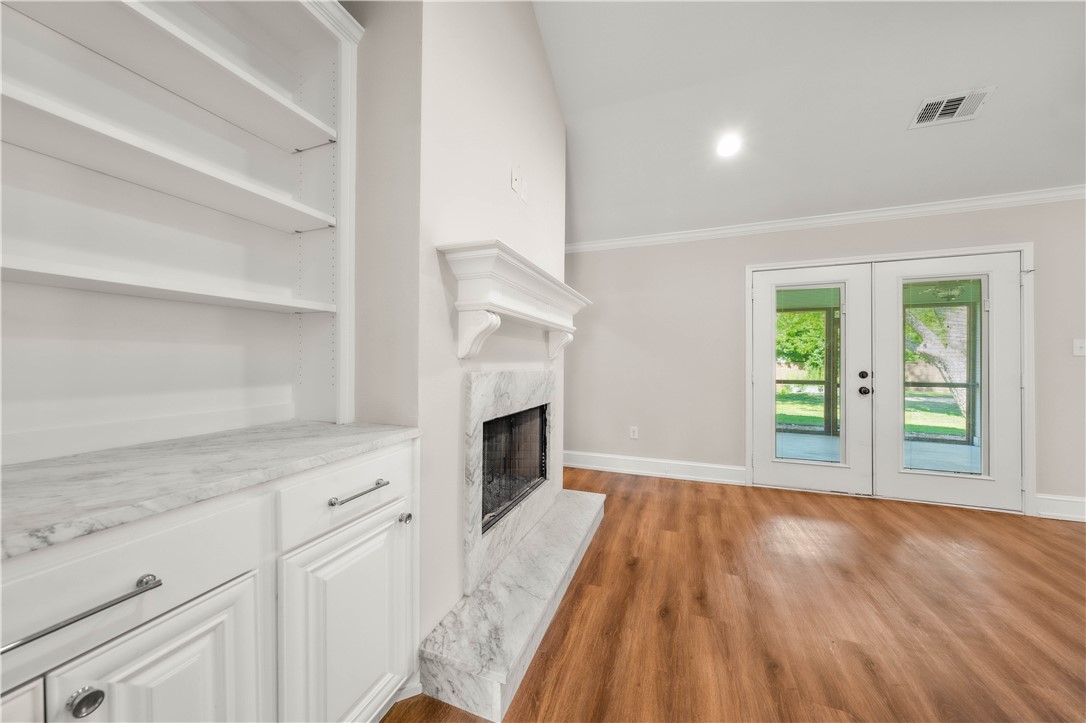 3405 MacArthur Drive Waco, TX 76708 - Photo 45 of 83 a view of empty room with wooden floor and fireplace