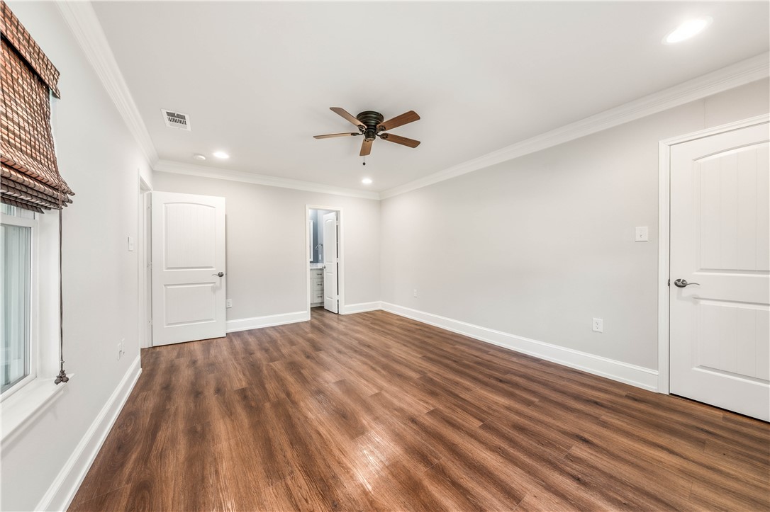 3405 MacArthur Drive Waco, TX 76708 - Photo 48 of 83 a view of empty room with wooden floor and fan