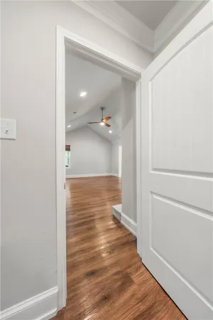a view of a house and a yard and trees