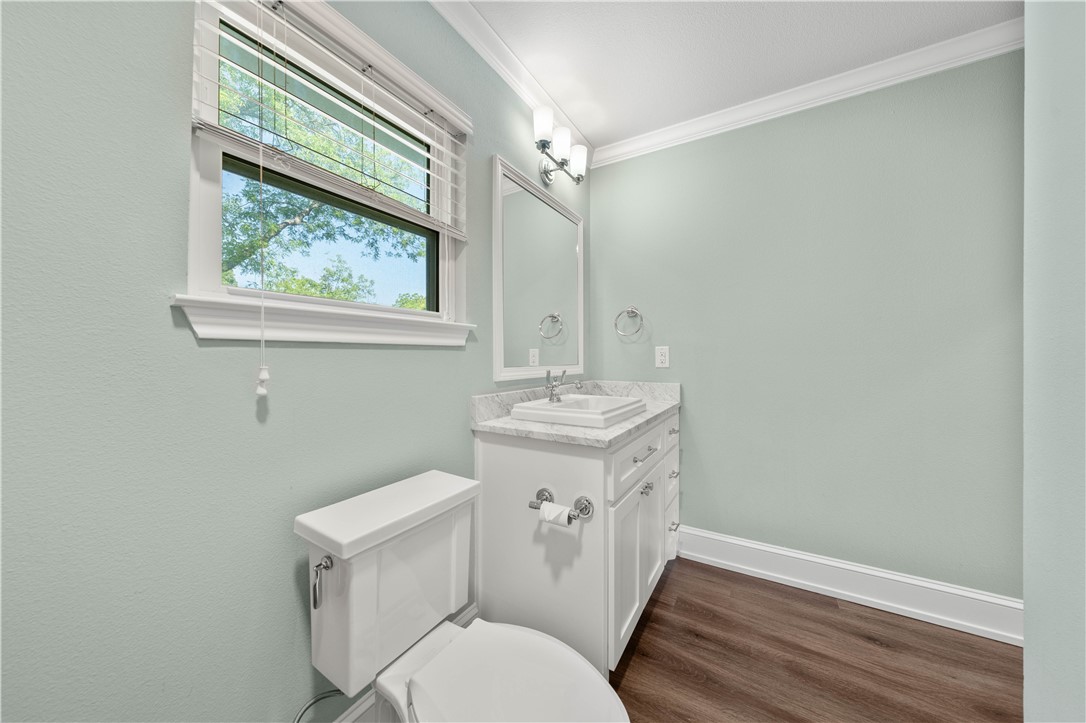 3405 MacArthur Drive Waco, TX 76708 - Photo 54 of 83 a bathroom with a toilet a sink and a window