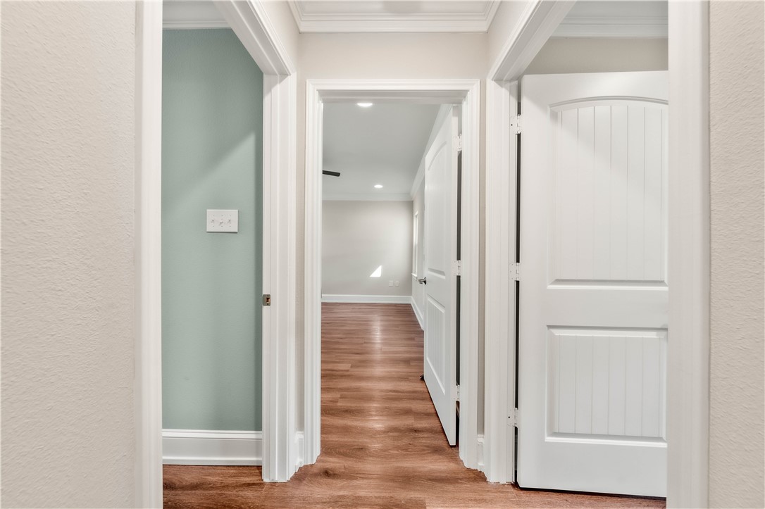 3405 MacArthur Drive Waco, TX 76708 - Photo 55 of 83 a view of a hallway with wooden floor and staircase