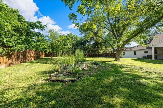 a aerial view of a house with a yard