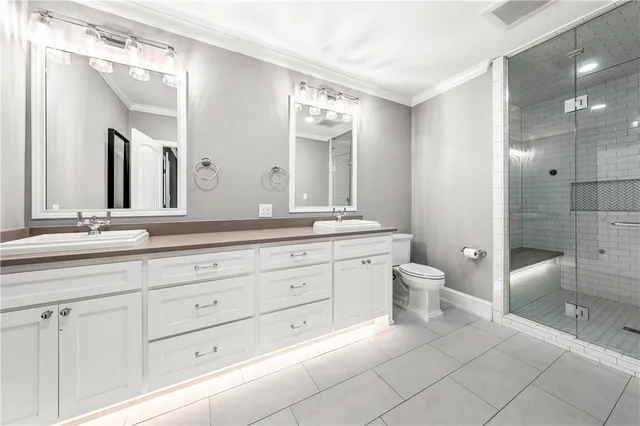 an empty room with wooden floor ceiling fan and windows