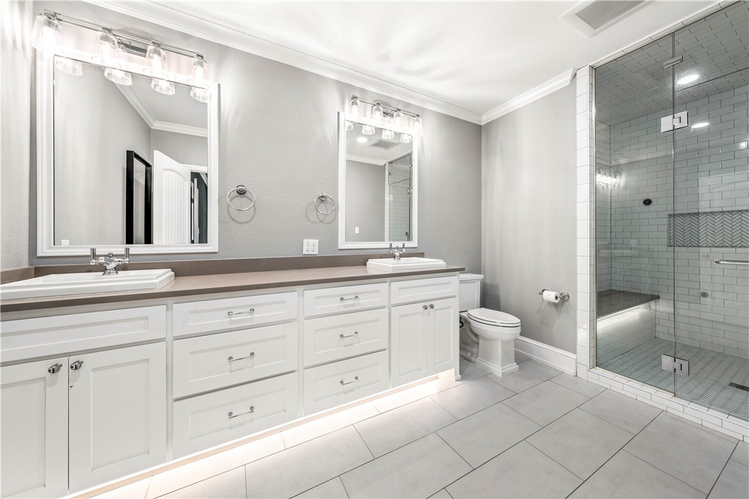 3405 MacArthur Drive Waco, TX 76708 - Photo 6 of 83 a bathroom with a granite countertop sink mirror and toilet