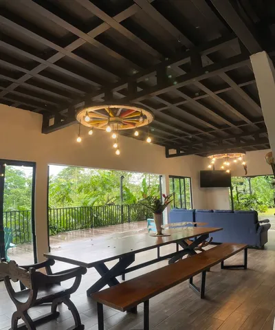 a outdoor room with chairs and a table