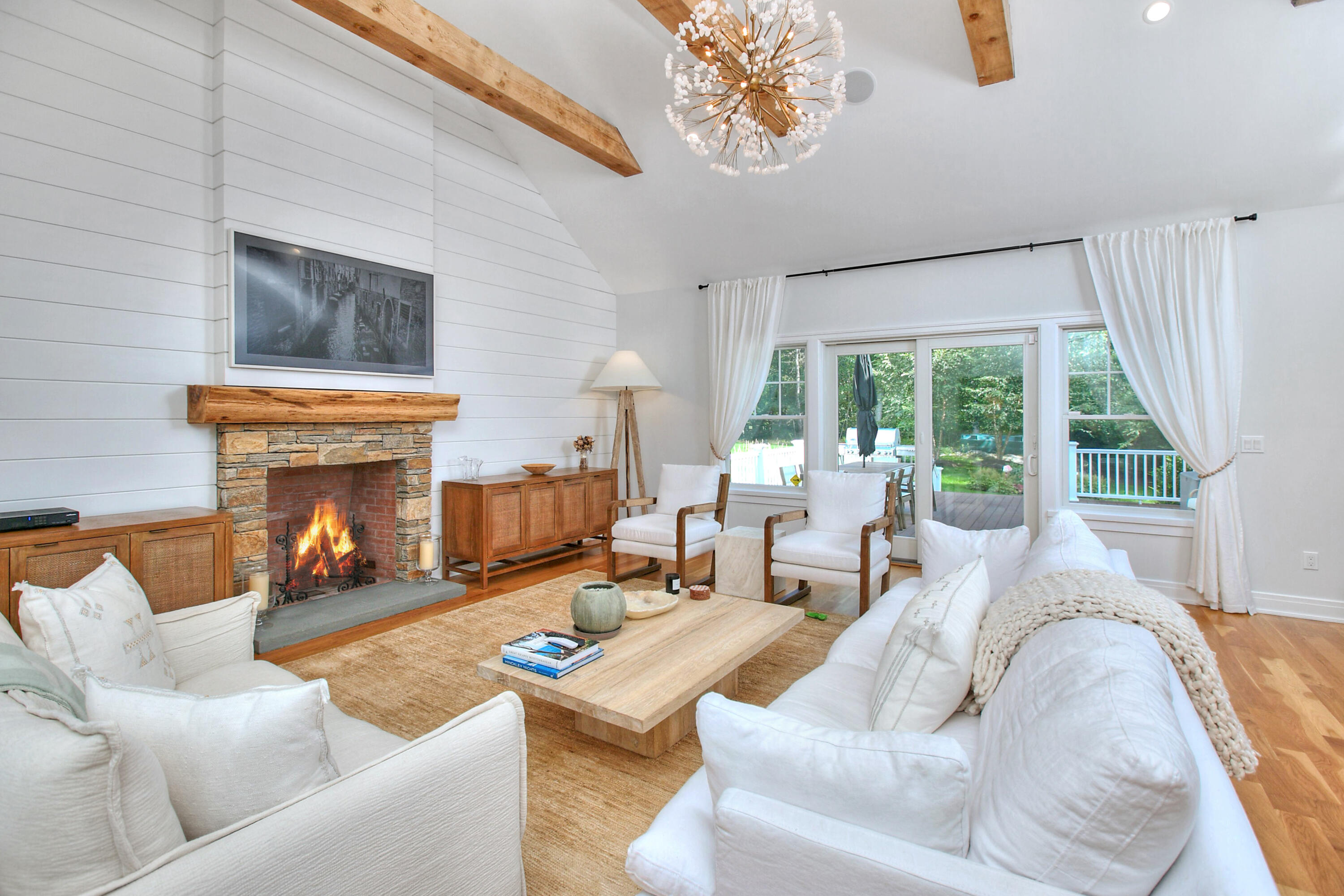 46 Blueberry Hill Road Redding, CT 06896 - Photo 12 of 32 a living room with furniture a fireplace and a large window