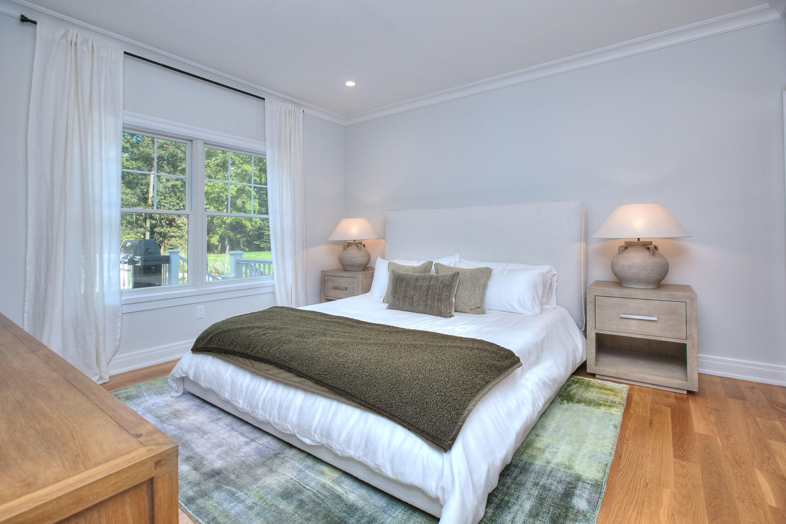 46 Blueberry Hill Road Redding, CT 06896 - Photo 14 of 32 a bedroom with a bed and wooden floor