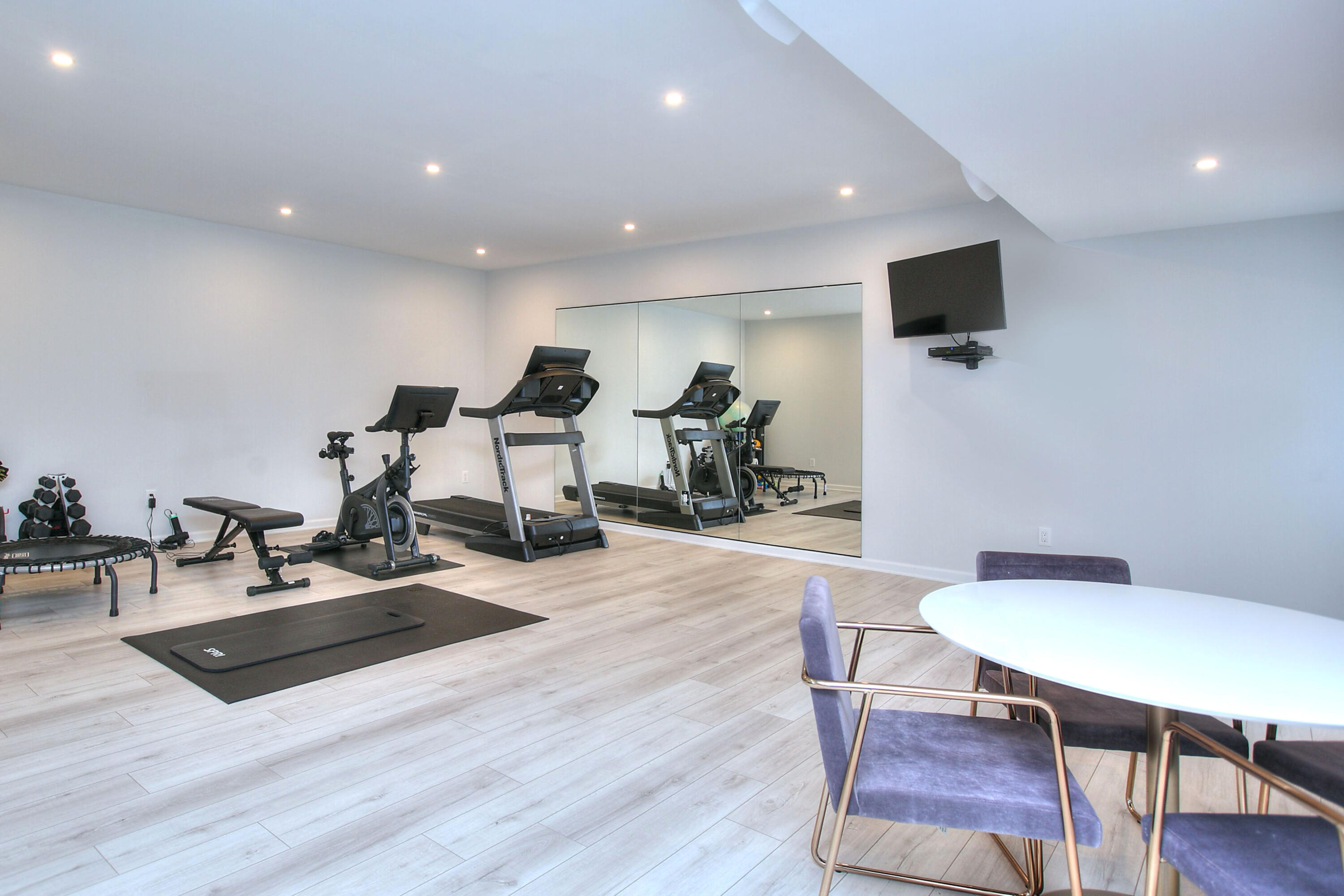 46 Blueberry Hill Road Redding, CT 06896 - Photo 24 of 32 a living room with furniture a flat screen tv and wooden floor