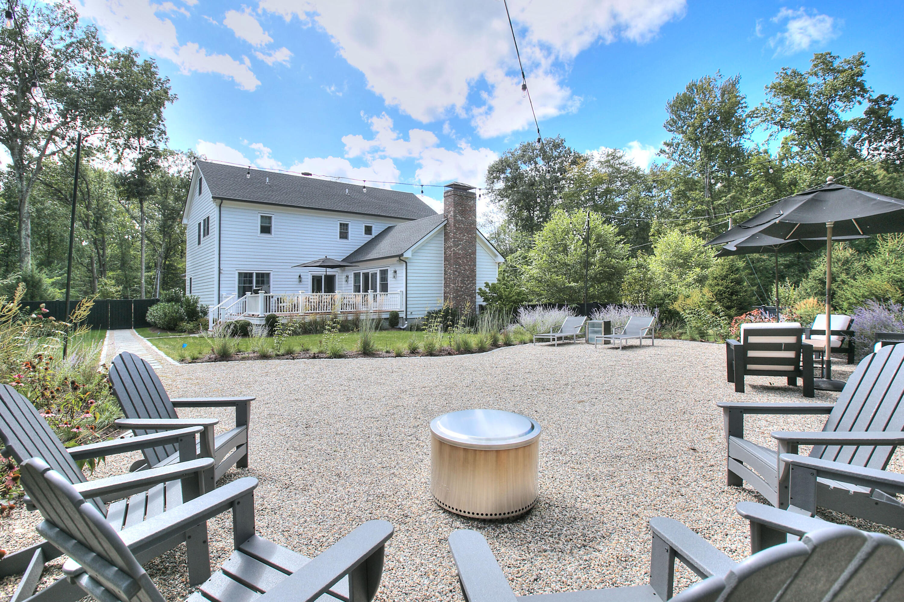 46 Blueberry Hill Road Redding, CT 06896 - Photo 27 of 32 a view of house with backyard and furniture