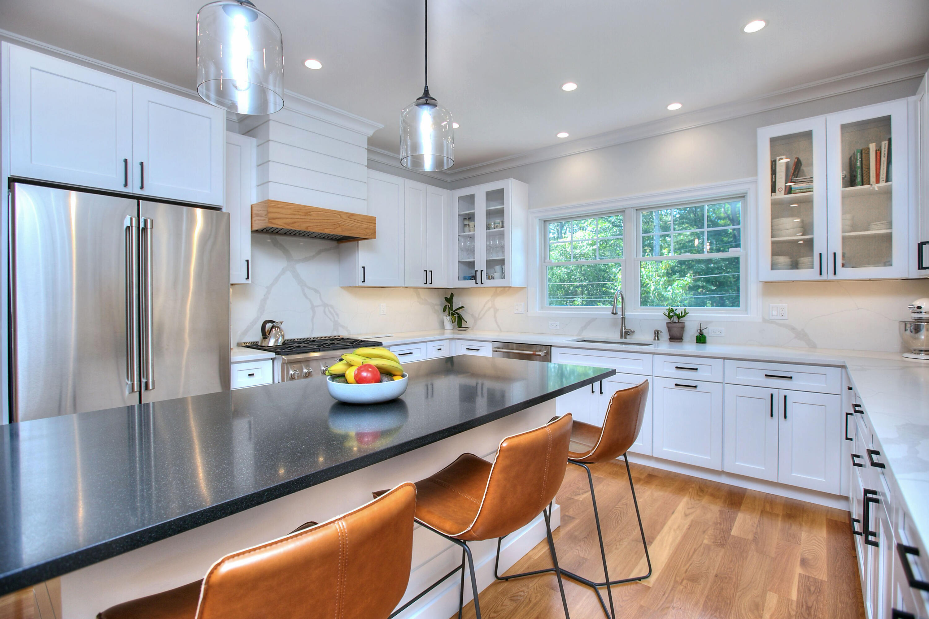 46 Blueberry Hill Road Redding, CT 06896 - Photo 7 of 32 a kitchen with stainless steel appliances granite countertop a refrigerator a sink a stove a dining table and chairs