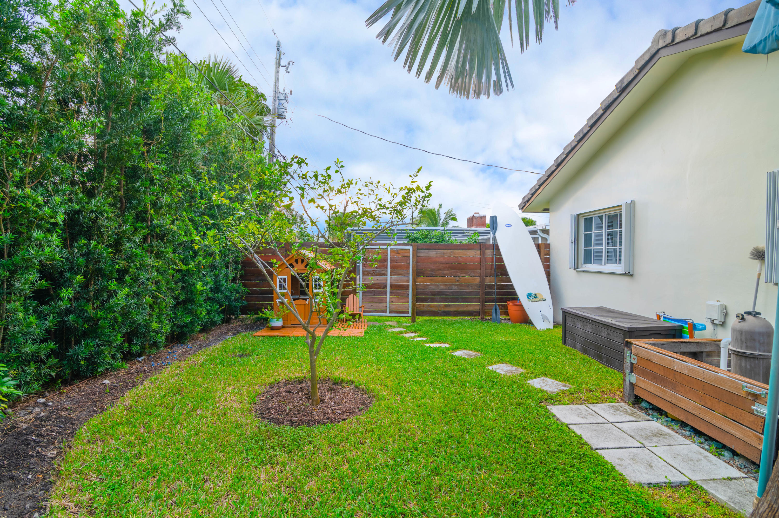 1502 Northwest 5th Street Boca Raton, FL 33486 - Photo 12 of 35 a front view of a house with a yard
