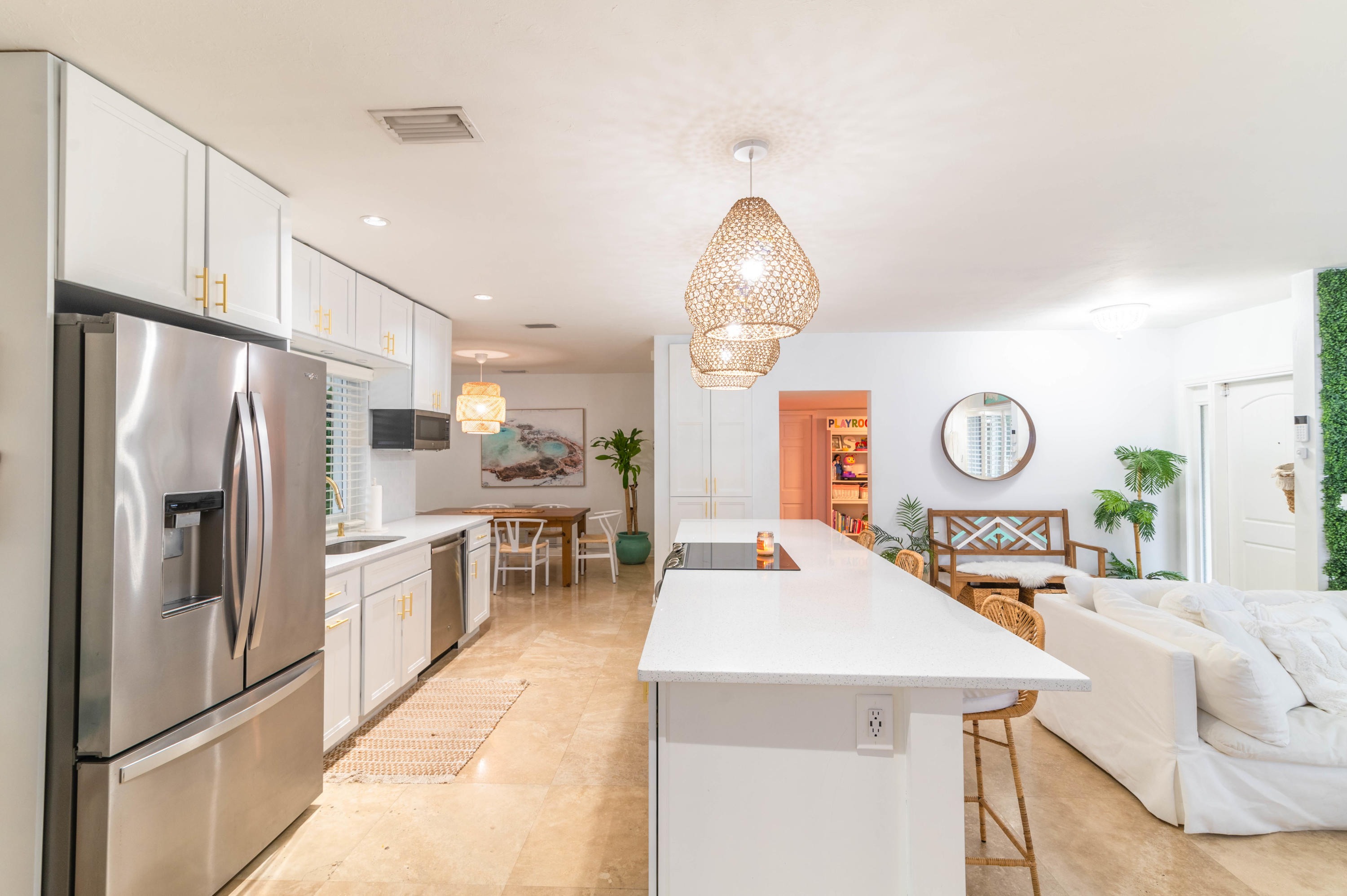 1502 Northwest 5th Street Boca Raton, FL 33486 - Photo 15 of 35 a kitchen with stainless steel appliances granite countertop a refrigerator a oven a sink and a dining table