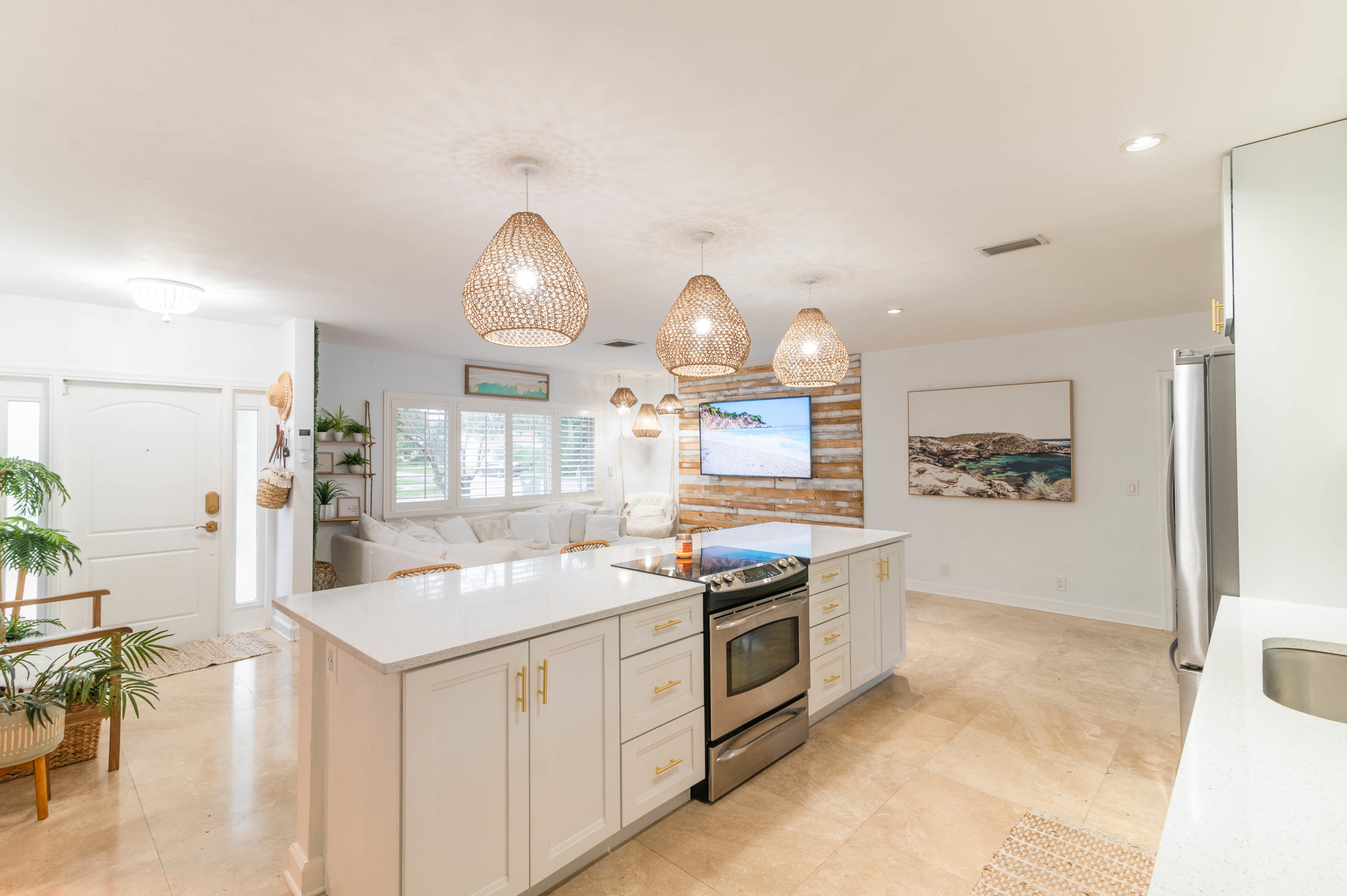 1502 Northwest 5th Street Boca Raton, FL 33486 - Photo 16 of 35 a kitchen with stainless steel appliances a stove a sink and a refrigerator