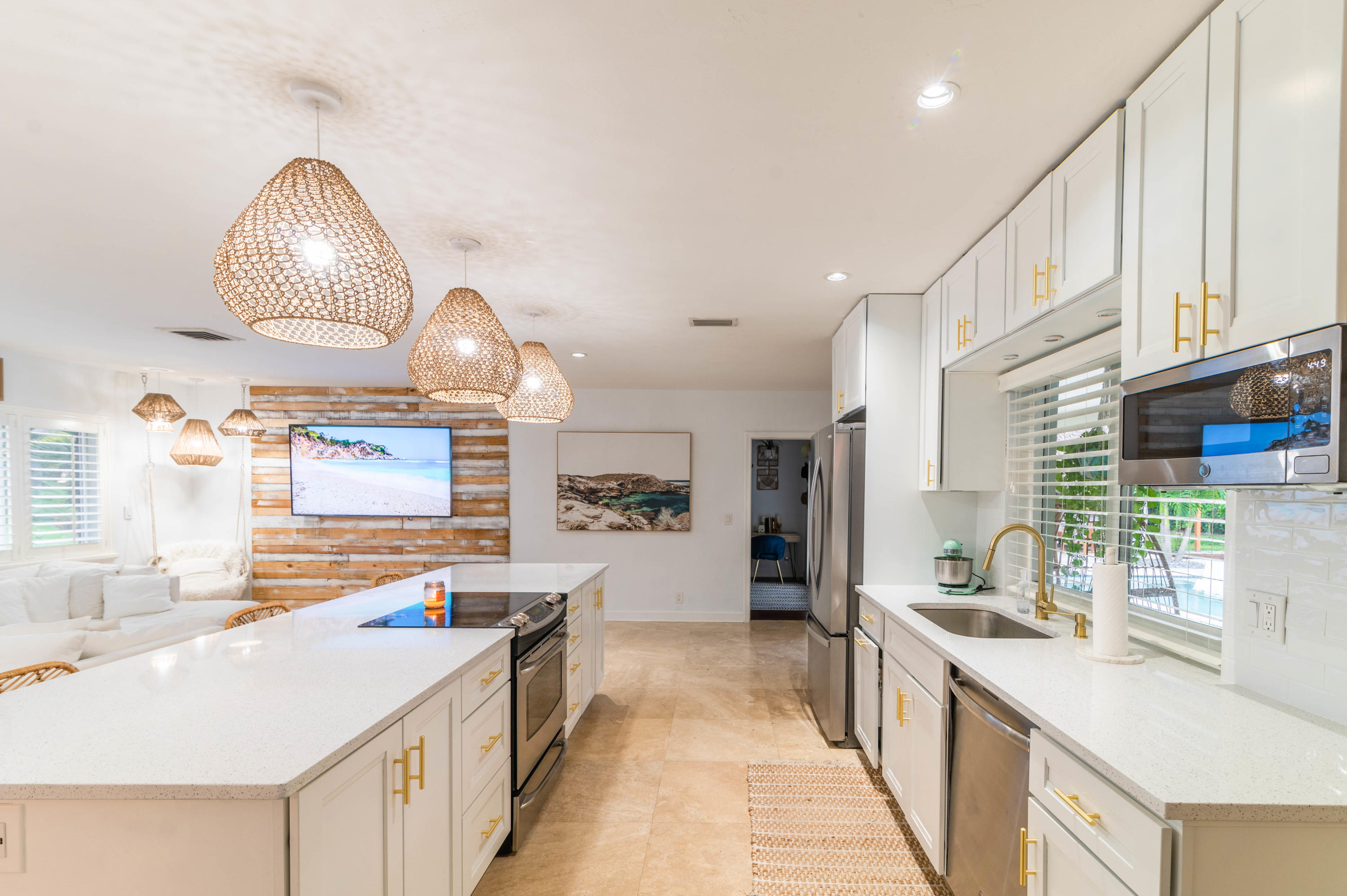 1502 Northwest 5th Street Boca Raton, FL 33486 - Photo 17 of 35 a kitchen with stainless steel appliances a sink stove and cabinets