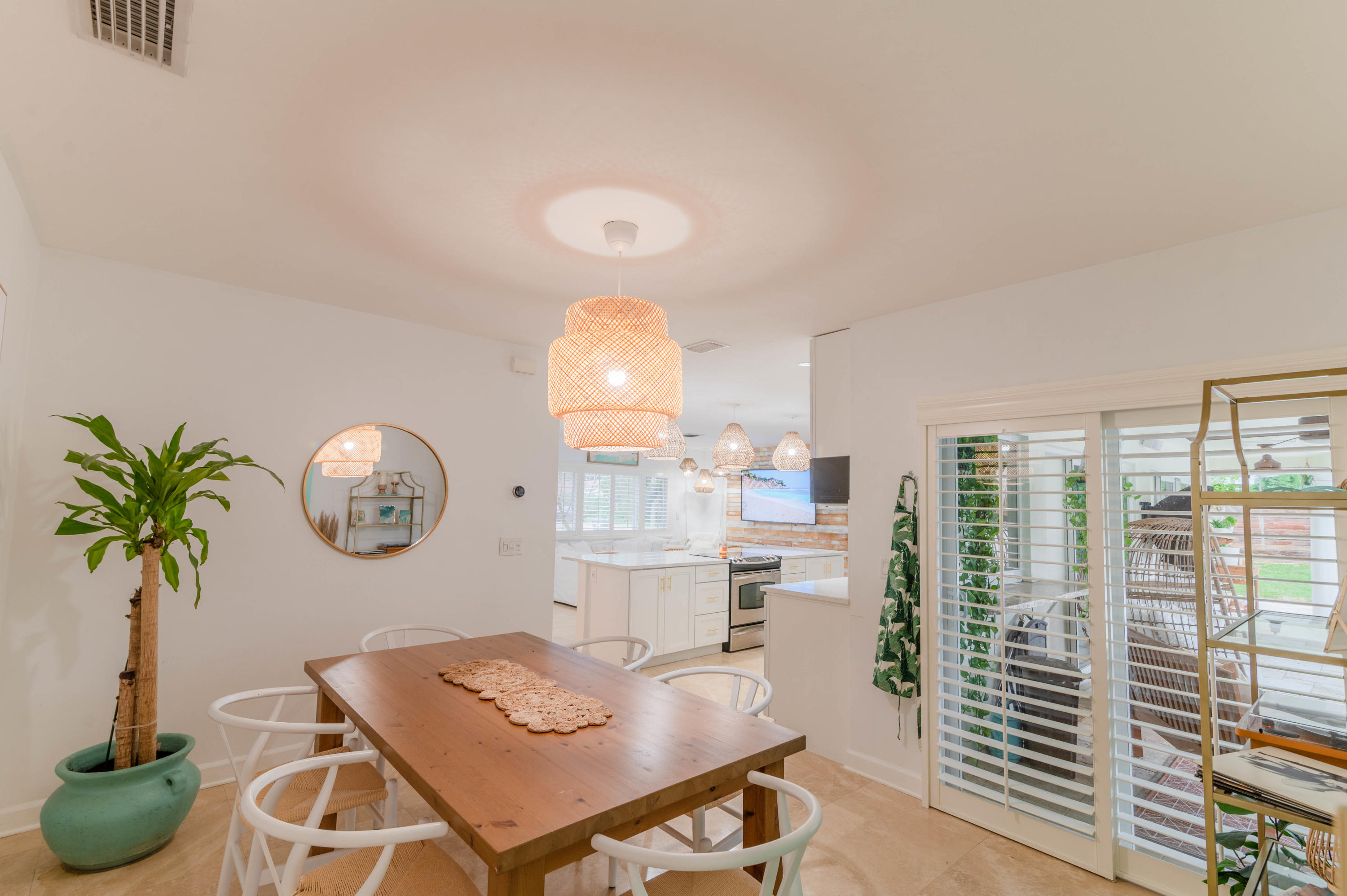 1502 Northwest 5th Street Boca Raton, FL 33486 - Photo 19 of 35 a view of a dining room with furniture window and wooden floor