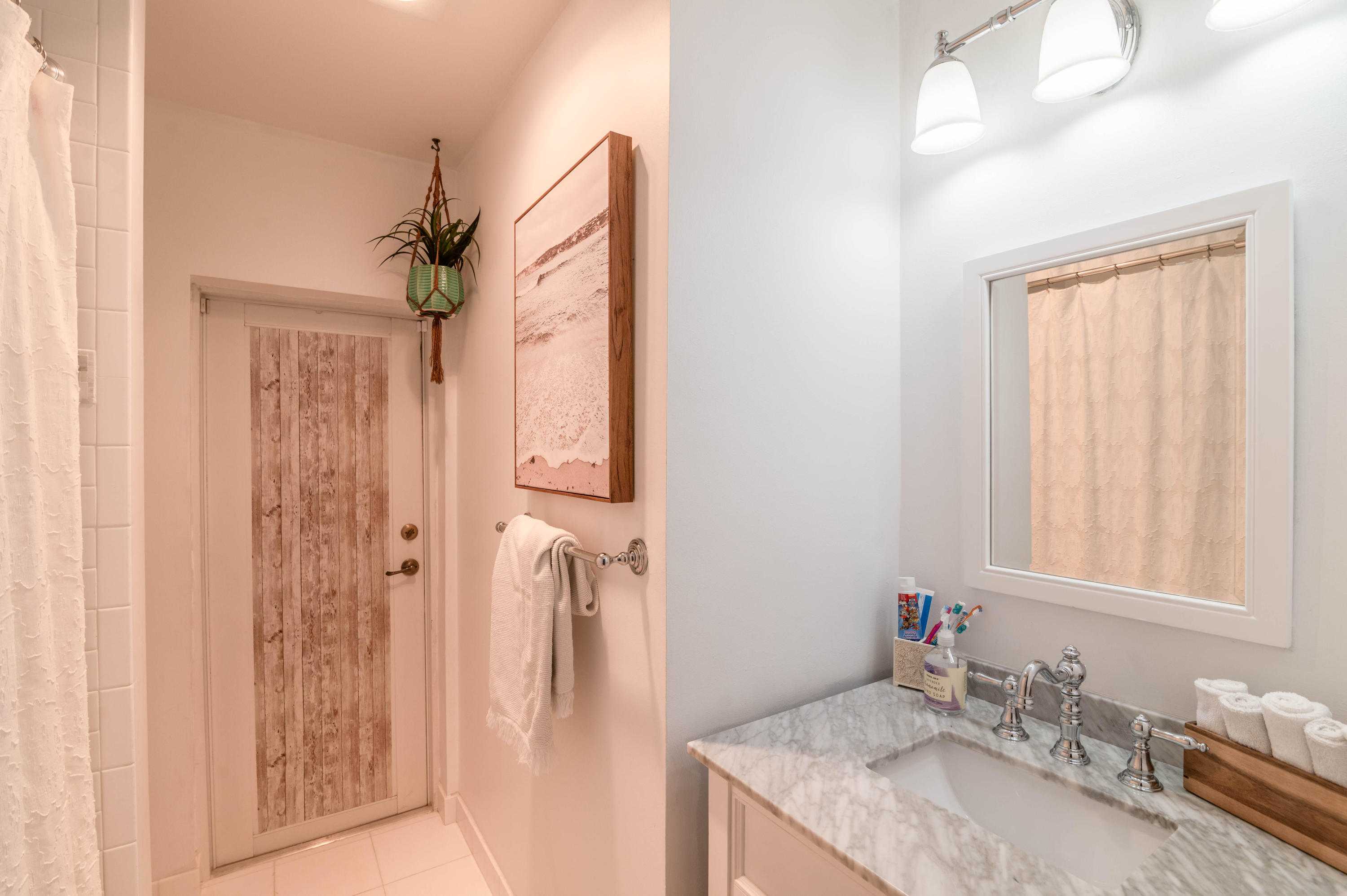 1502 Northwest 5th Street Boca Raton, FL 33486 - Photo 29 of 35 a bathroom with a granite countertop sink a mirror and shower