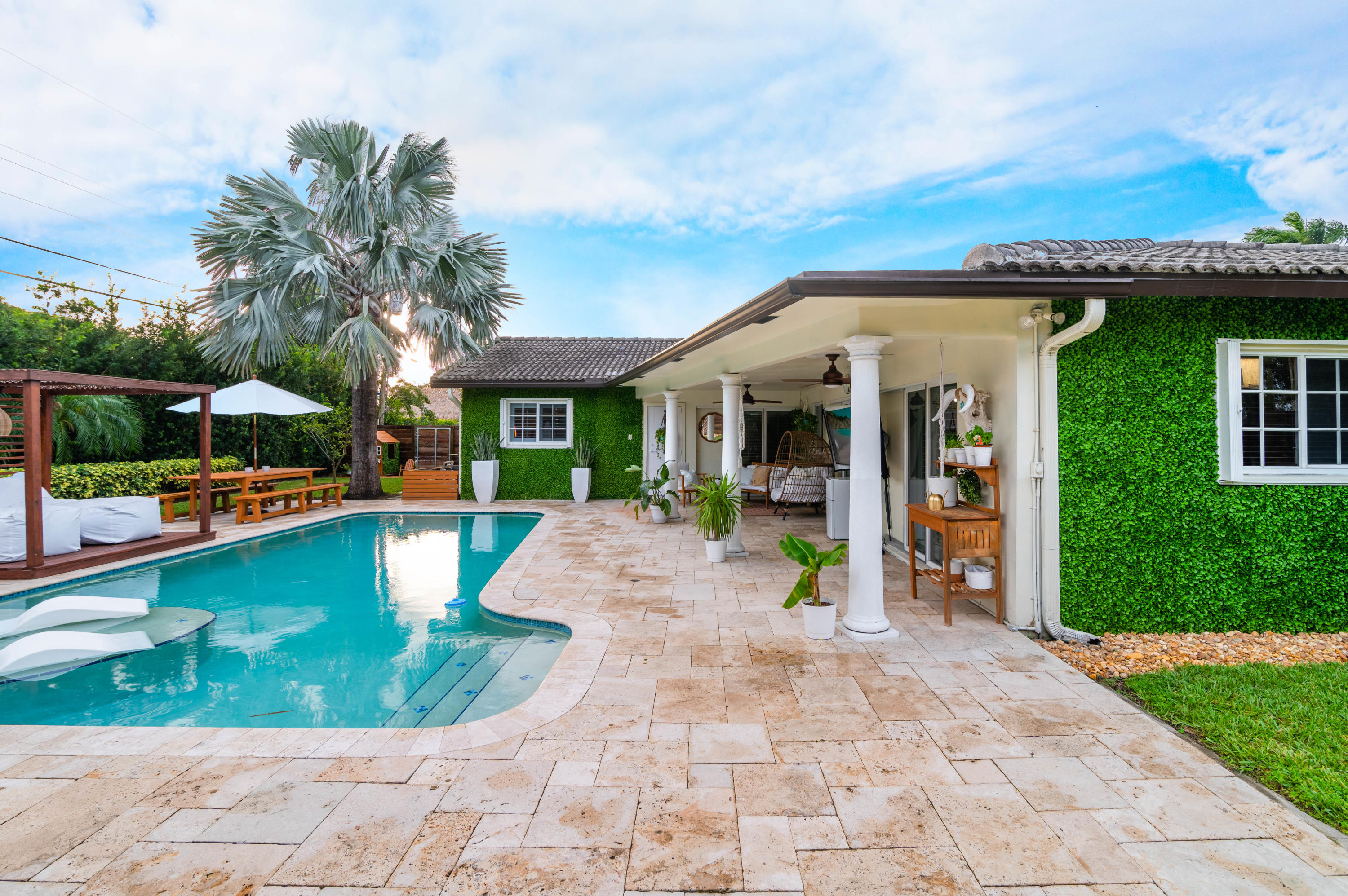 1502 Northwest 5th Street Boca Raton, FL 33486 - Photo 5 of 35 a view of a house with sitting area and garden