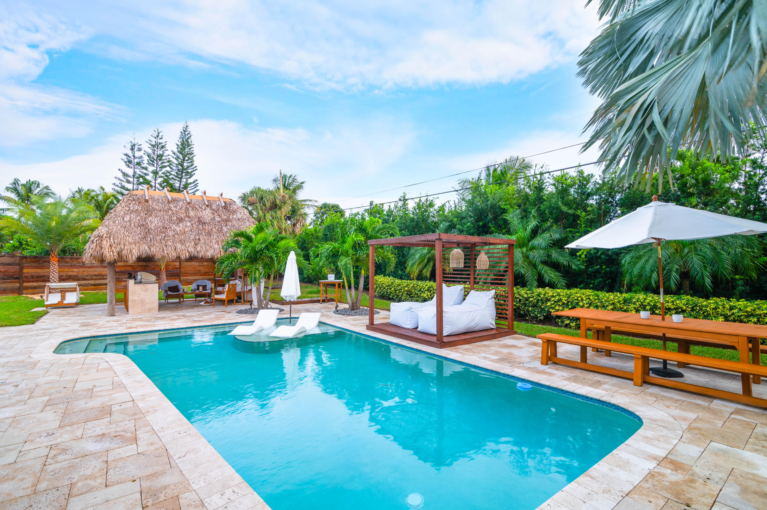 1502 Northwest 5th Street Boca Raton, FL 33486 - Photo 8 of 35 a swimming pool with outdoor seating and yard
