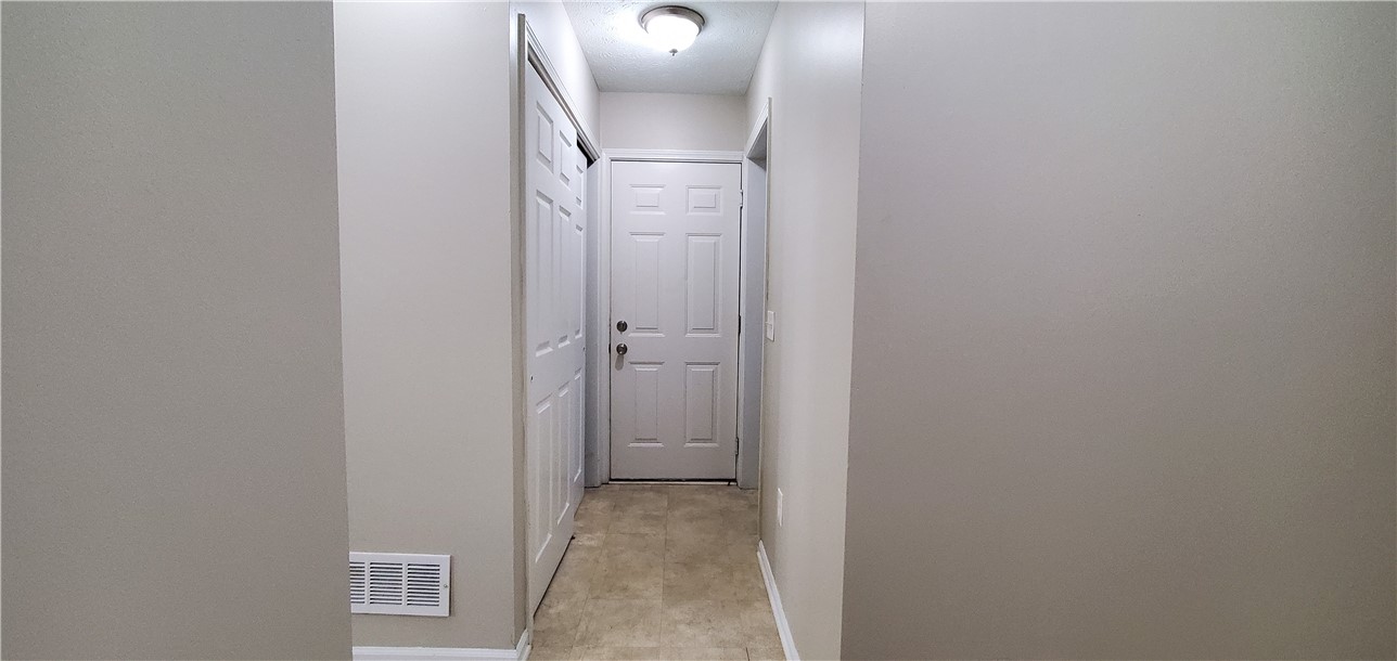 79 Eastview Commons Road Gates, NY 14624 - Photo 11 of 32 Hall to Utilities, Garage and Laundry Room