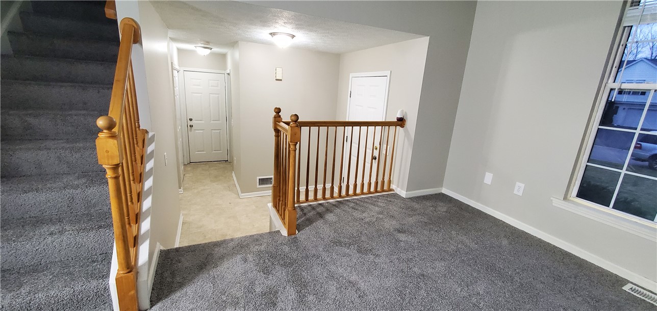 79 Eastview Commons Road Gates, NY 14624 - Photo 3 of 32 Living Room Facing Entry Way and Hall to Laundry R